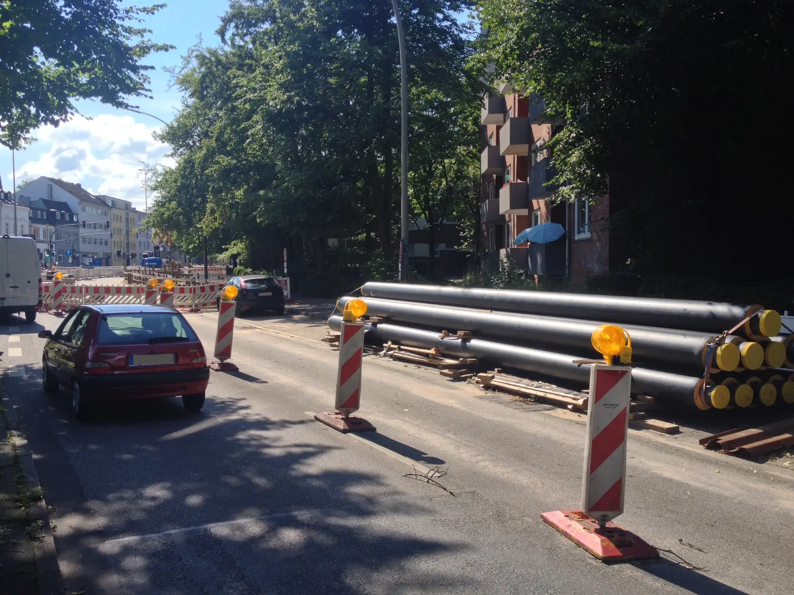 Pre-insulated bonded pipes staged at a district heating construction site